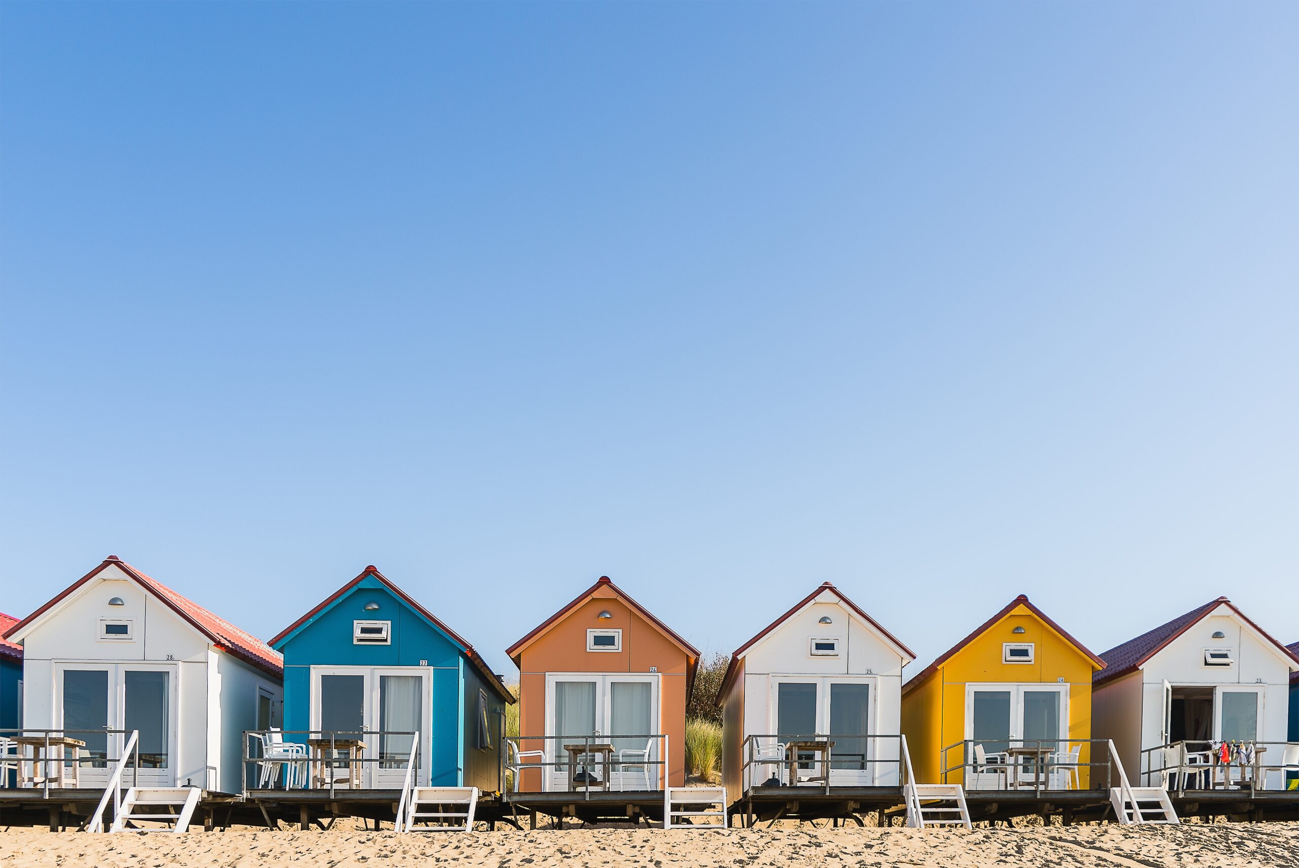 Home wide angle shot of camping de nolle in vlissingen, netherlands under a blue sky